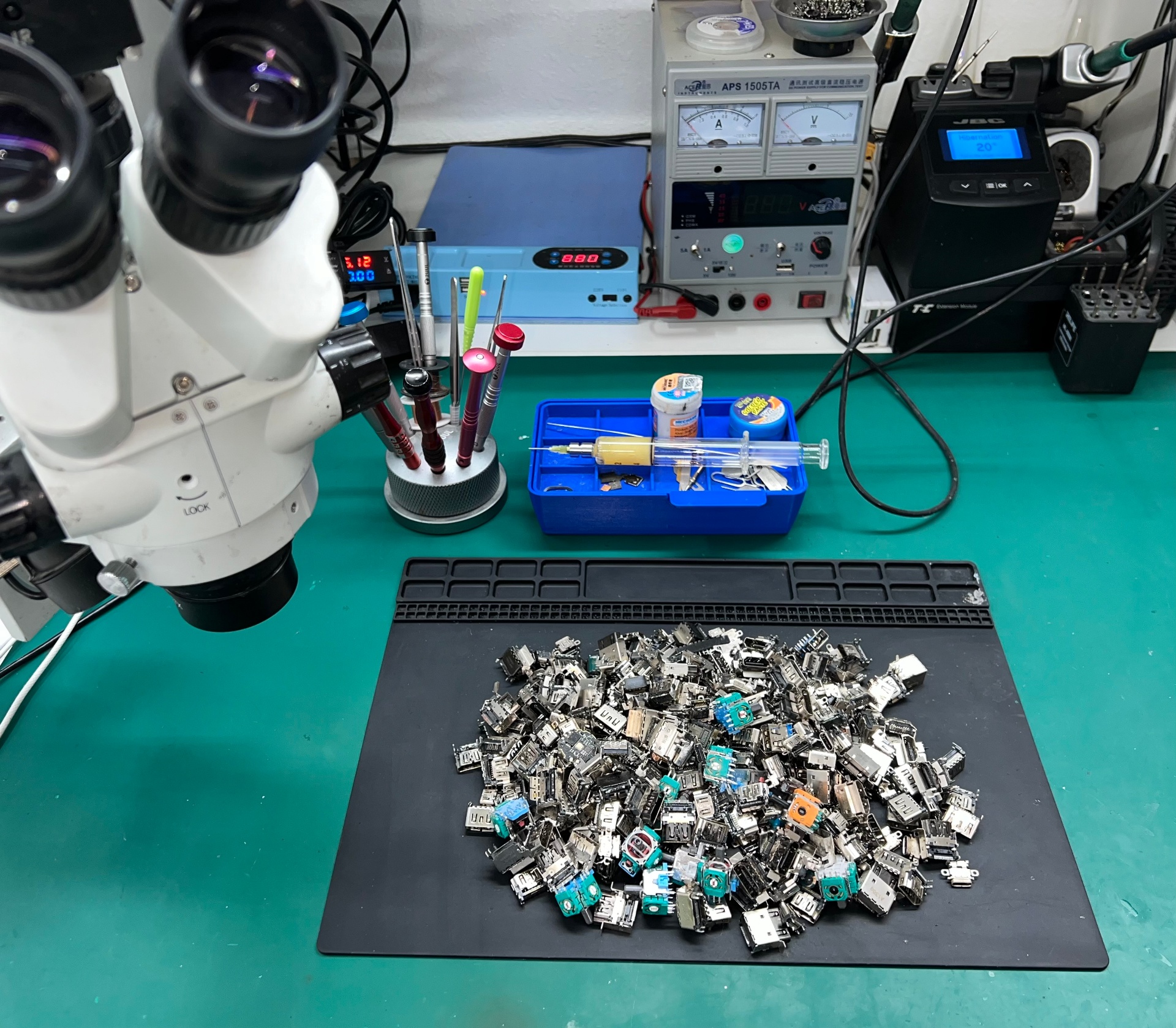 Hundreds of HDMI ports replaced — micro soldering workstation with microscope and tools